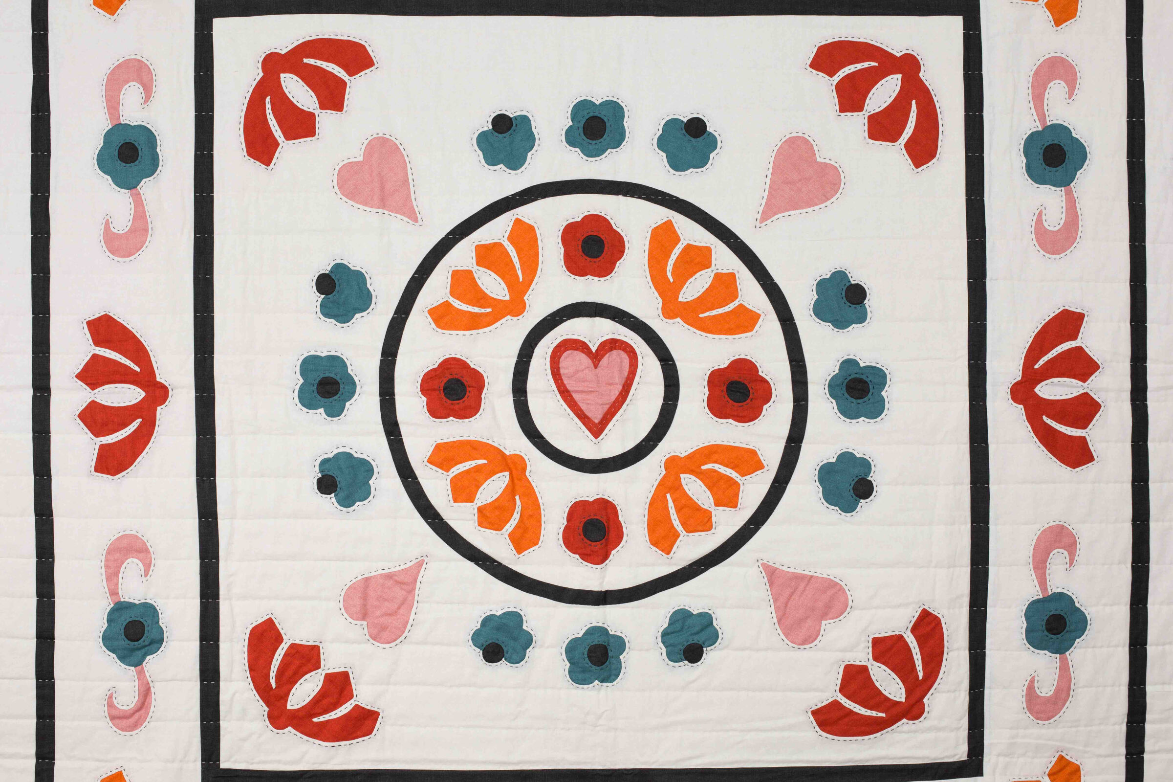 Garden Festival quilt by Karen Lewis inspired by the Ladies Work Society heritage quilt, featuring appliqué floral and paisley motifs