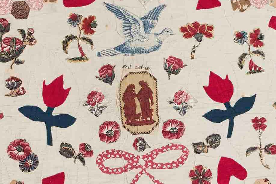 Close-up of vintage patchwork fabrics in Agnes Bentham quilt showing dress prints and furnishing textiles
