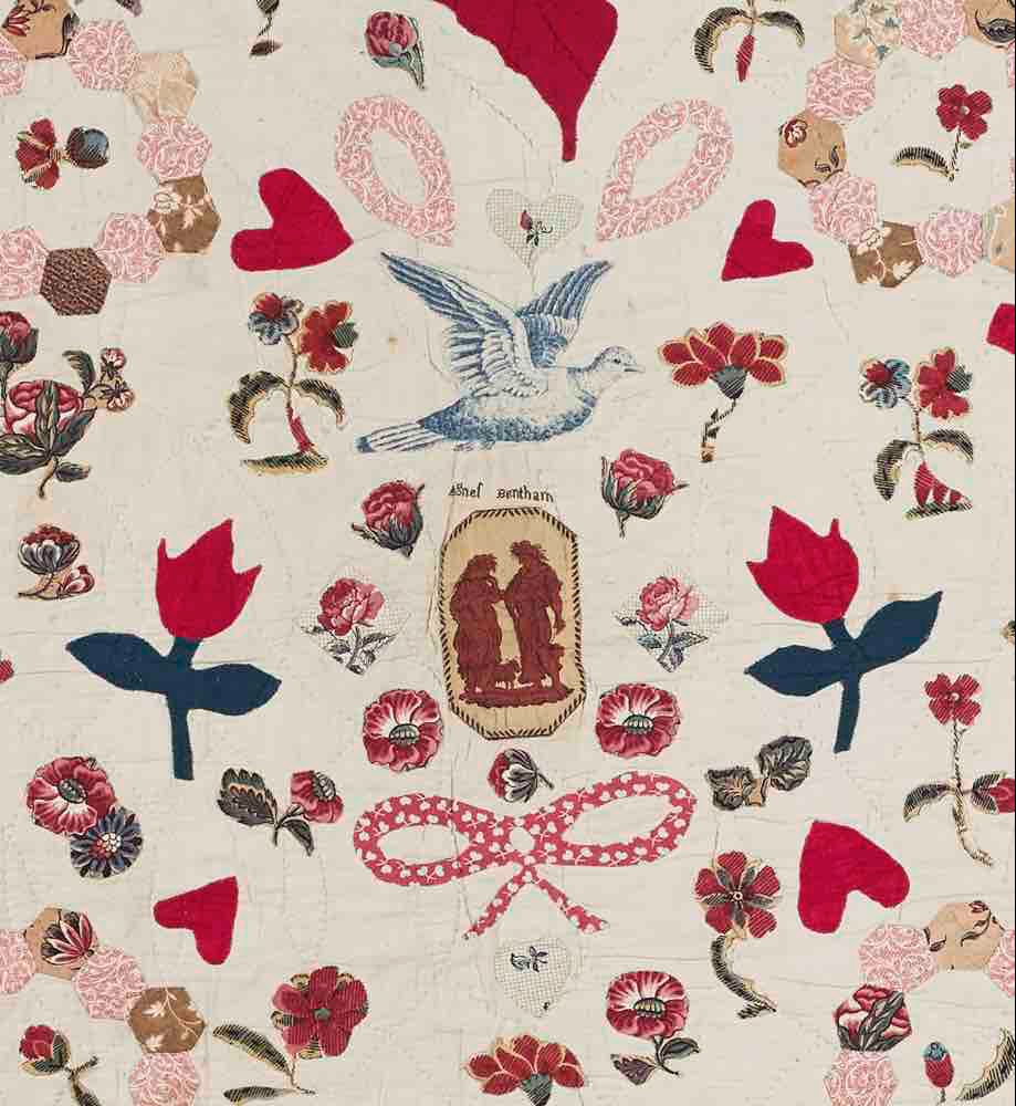 Close-up of vintage patchwork fabrics in Agnes Bentham quilt showing dress prints and furnishing textiles