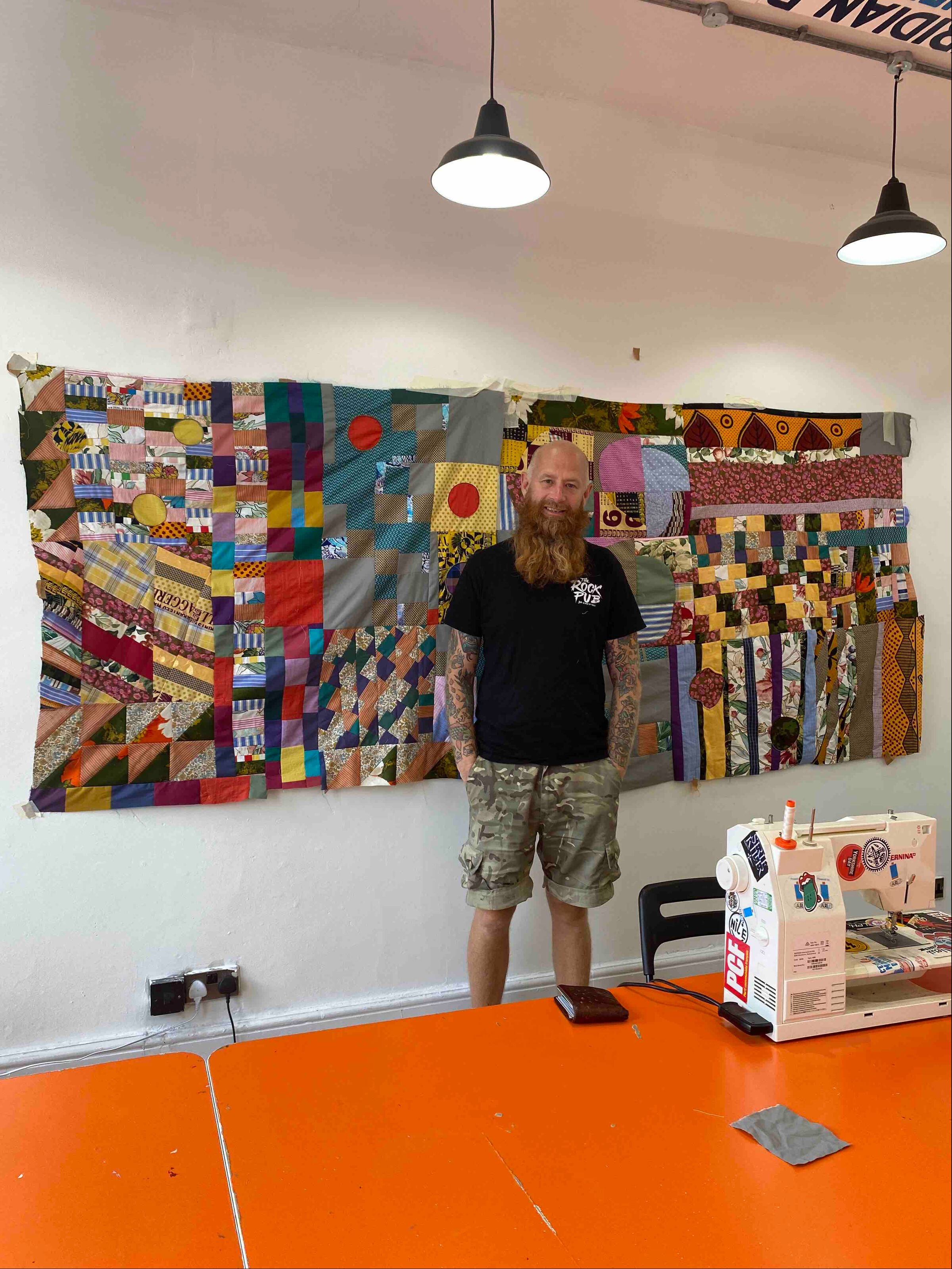 Chris English, contemporary quilter and founder of Quilt Huddersfield, pictured in his studio