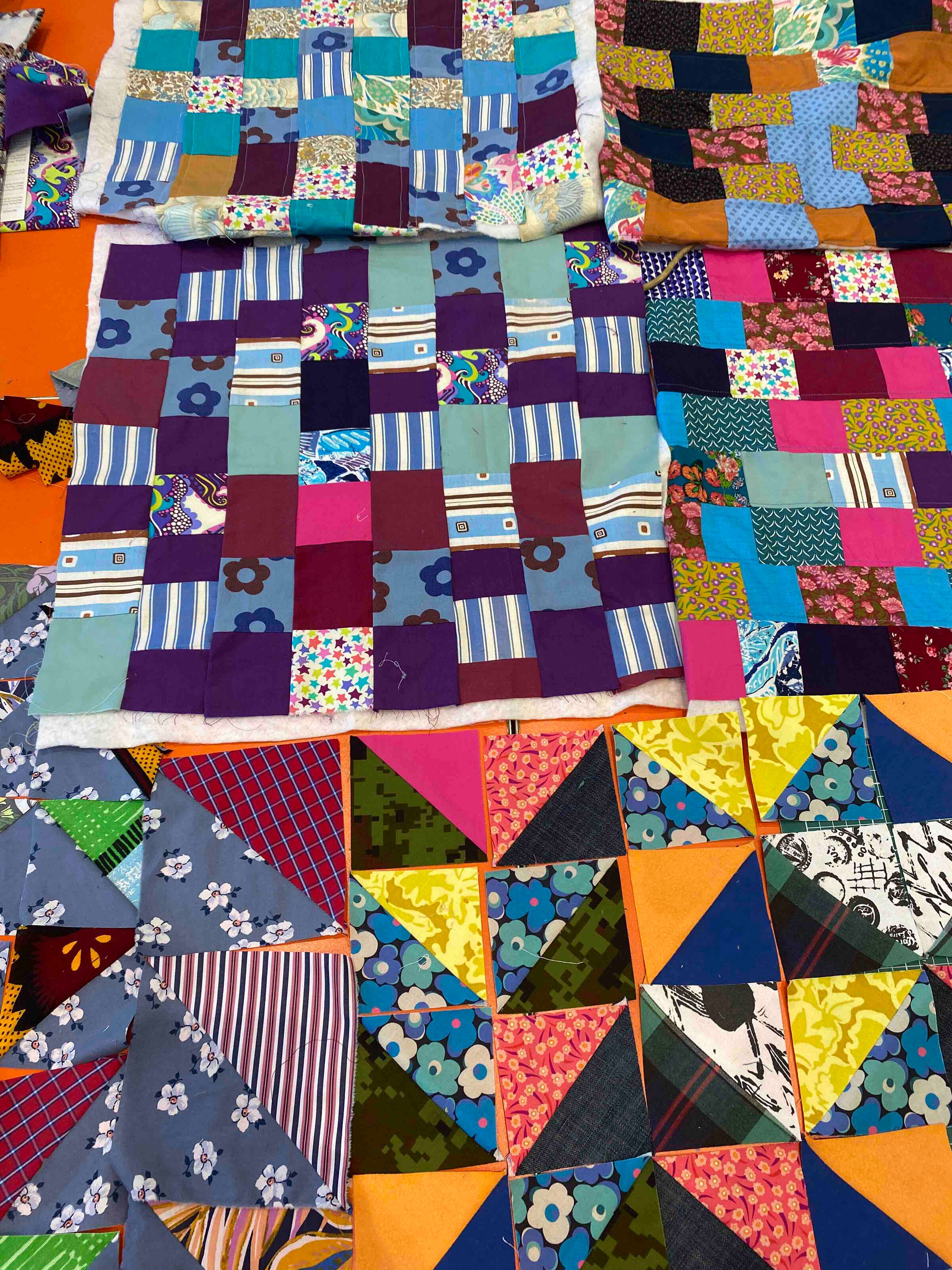 Chris English teaching a quilting session at Quilt Huddersfield, demonstrating techniques to participants