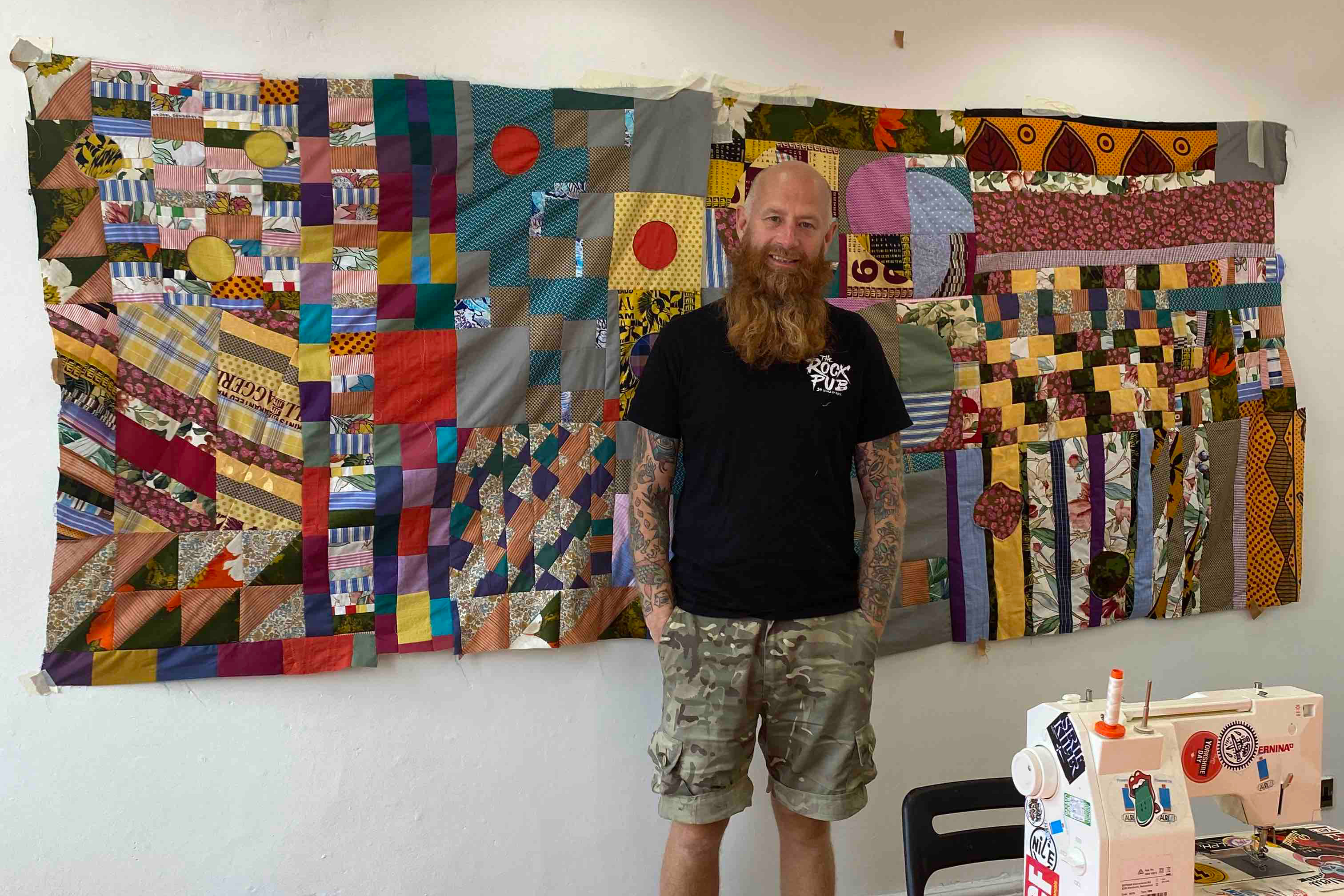 Chris English, contemporary quilter and founder of Quilt Huddersfield, pictured in his studio