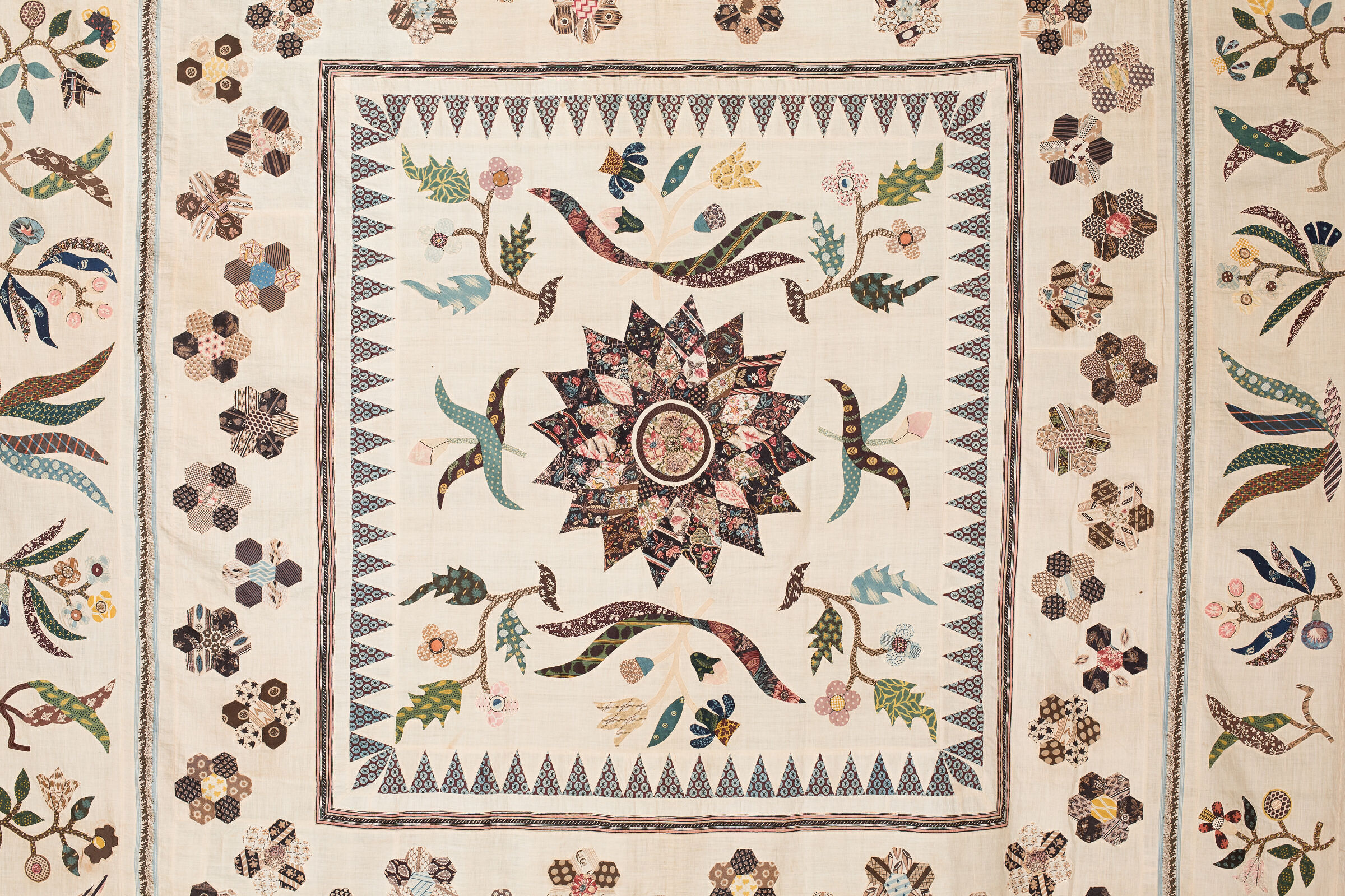 Close-up of intricate inlaid patchwork technique on the Gooch Coverlet