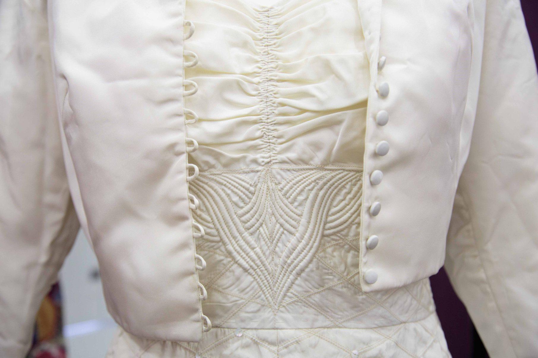 Close up of detail on bodice of corded 1950s wedding dress