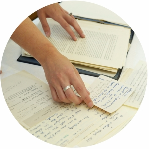 Person looking through historical papers