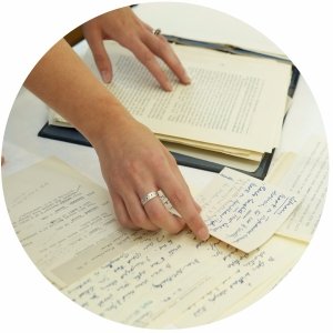 Person looking through historical papers