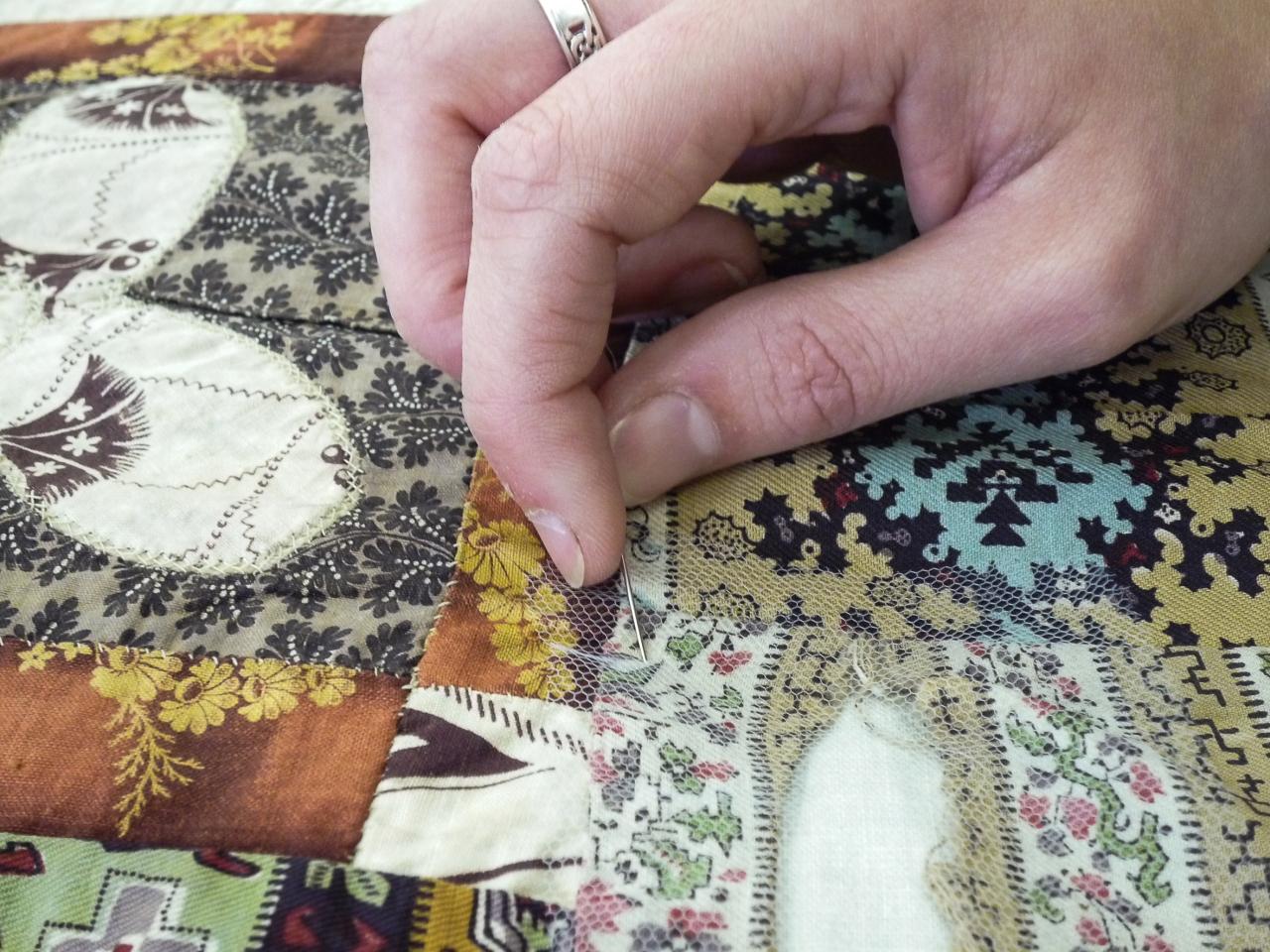 Conservator working on quilt