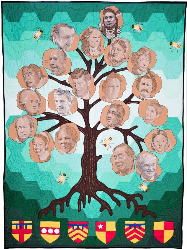 Quilt depicting an oak tree with images of key figures in the field of human rights