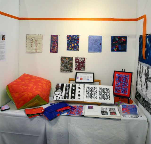 A display of quilt samples on display table