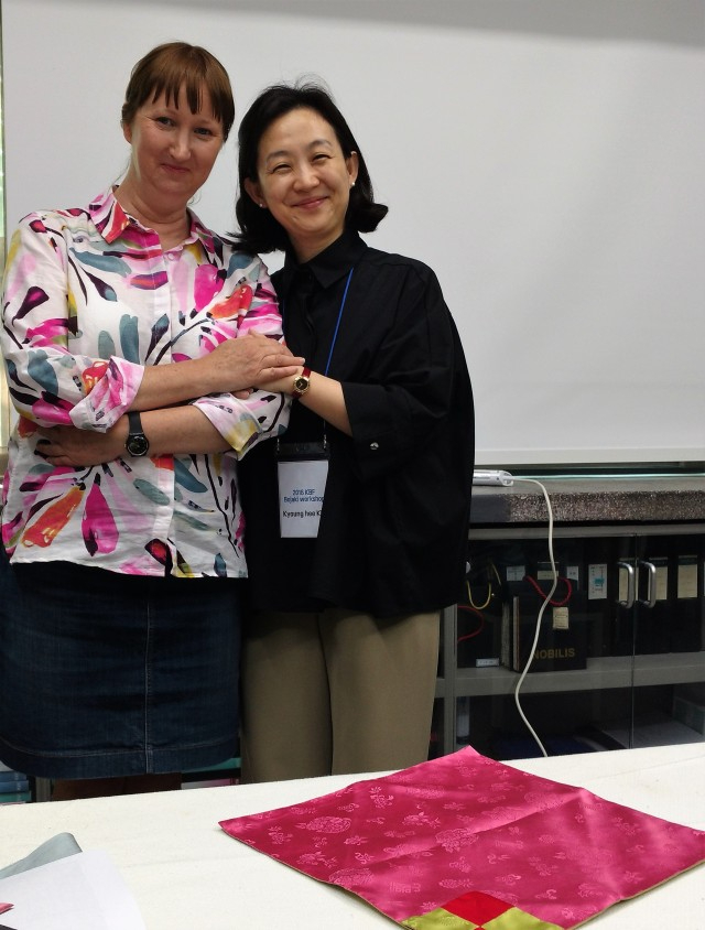 Sara Cook and textile professor, Kim Kyung Hee stood together in classroom