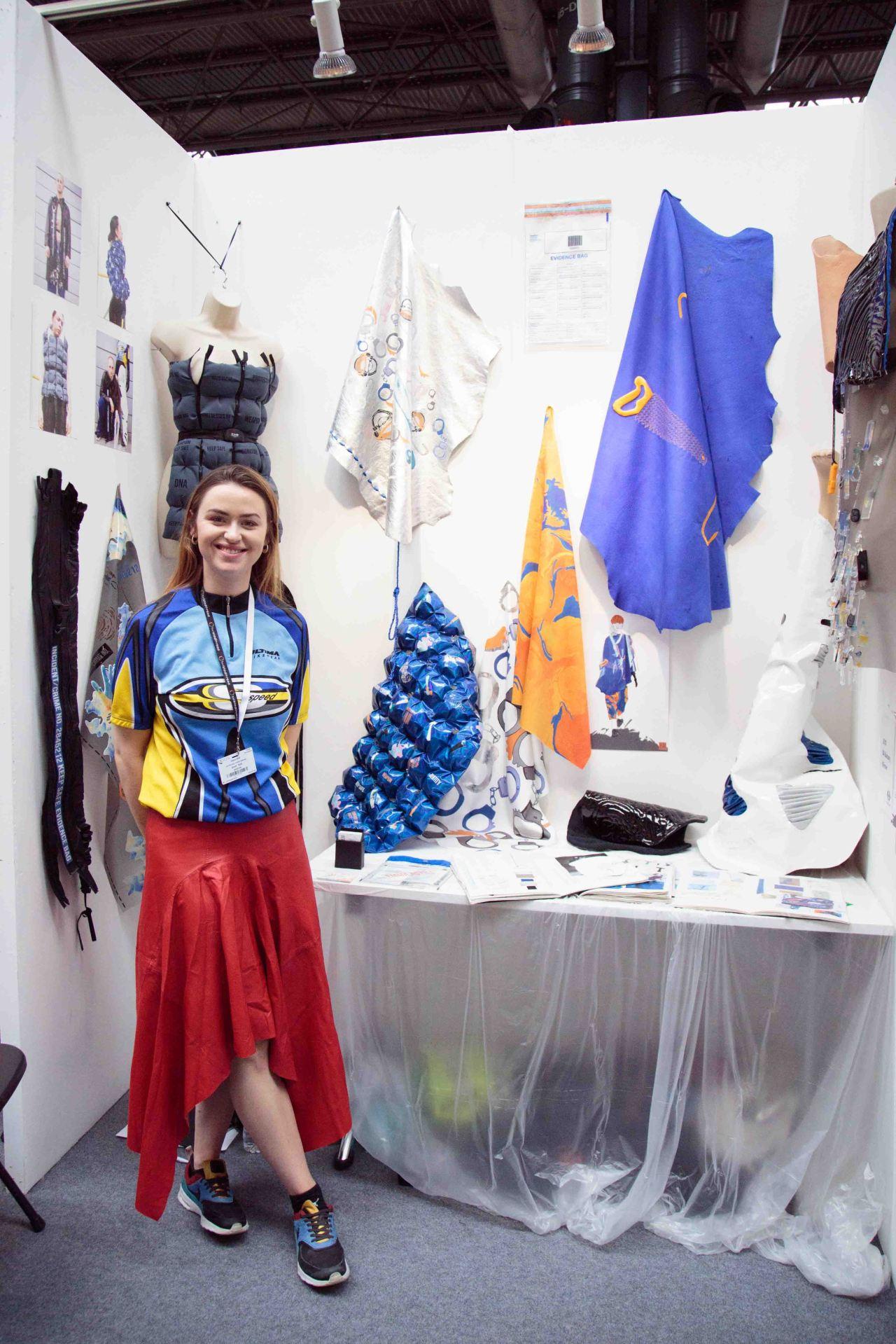 Emma Astill stood in front of her work at the Festival of Quilts