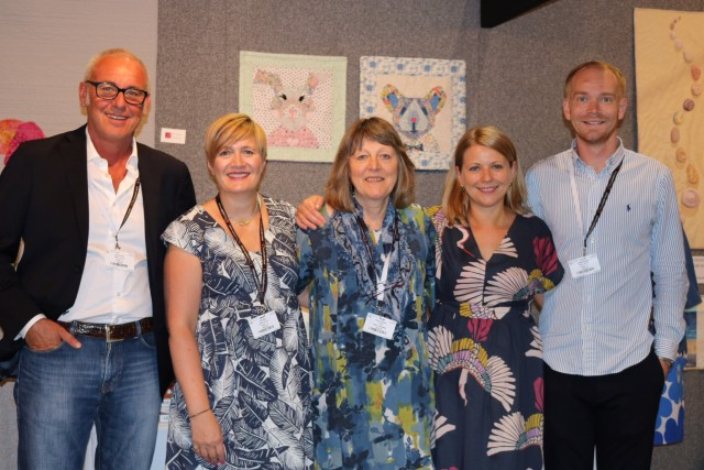 Jenni Smith stood with Sheena Norquay and members of the Aurifill team at Festival of Quilts 2018.