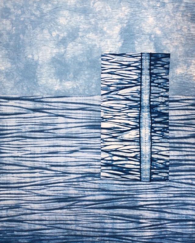 Summer Blues by Janice Gunner: quilt made of two different patterned blue fabrics in horizontal blocks, with a smaller vertical block on top