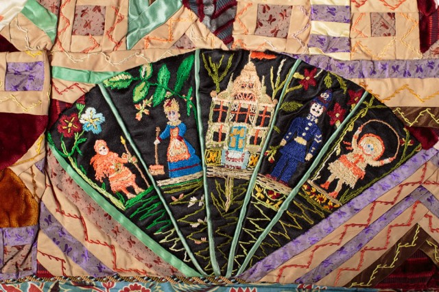 Close up of the Jubilee quilt showing small figures in a fan shape