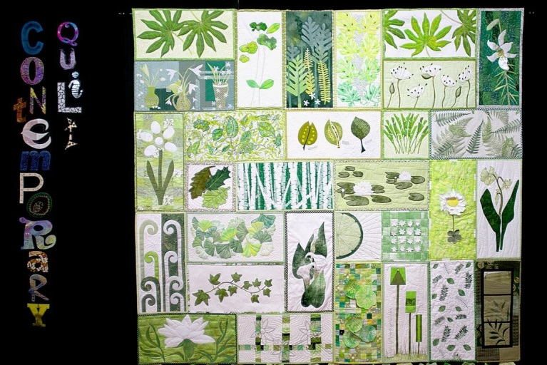Contemporary Quilt: quilted banner made of rectangles of green depicting leaves and nature