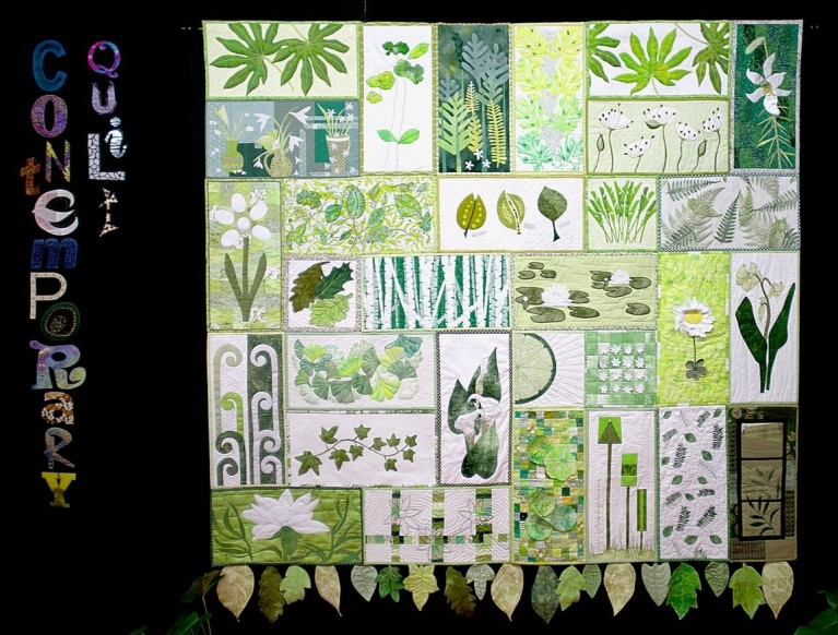 Contemporary Quilt: quilted banner made of rectangles of green depicting leaves and nature
