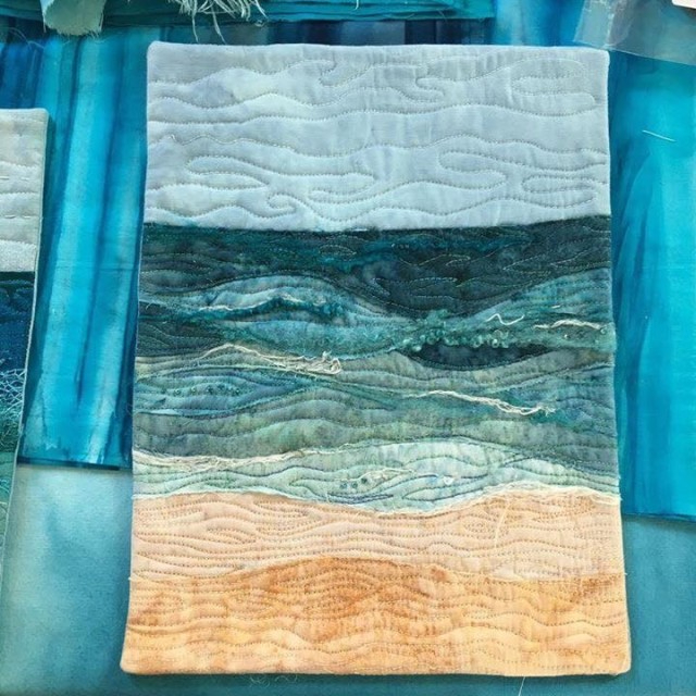 Inspirational Landscape: A sample quilt depicting a sandy beach and the sea
