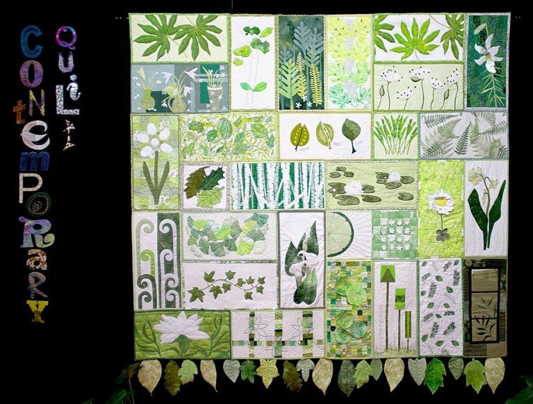 Contemporary Quilt: quilted banner made of rectangles of green depicting leaves and nature