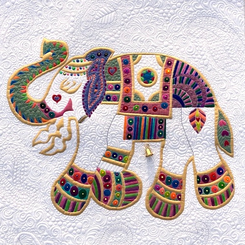 Decorative elephant on a white quilted background