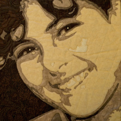 Persons face depicted in a quilt