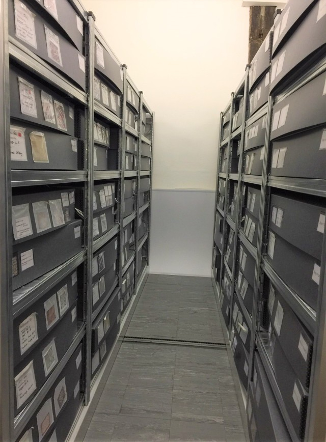 Carefully stored quilts resting in their temperature controlled store.