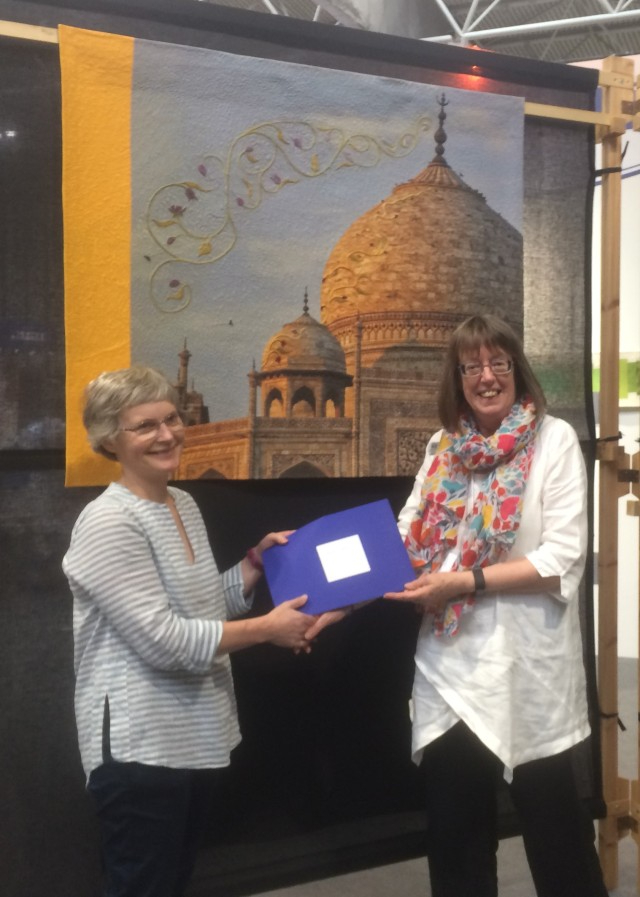 Pippa Wardman being presented The Festival of Quilts Visitor?s Choice Award for her quilt .Taj Mahal at Sunset,