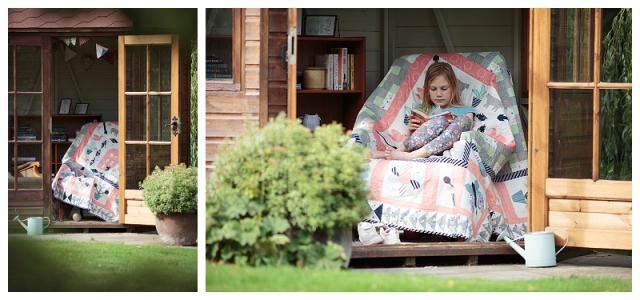 Armchair covered by a quilt.