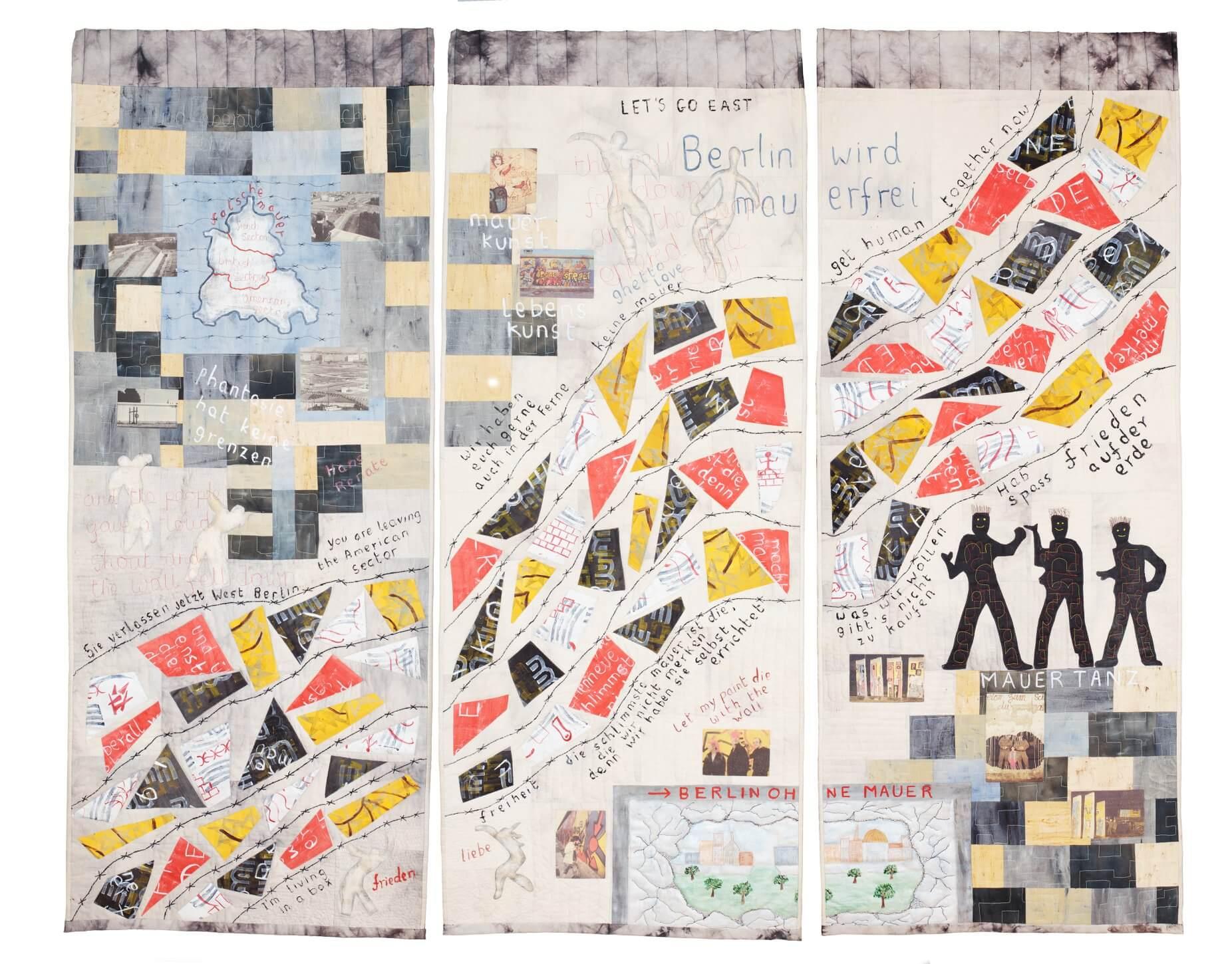 Quilt depicting the berlin wall with barbed wire quilting running across all three triptych pieces and uses fabric painting, appliqué, photograph transfers, quilting and embroidery