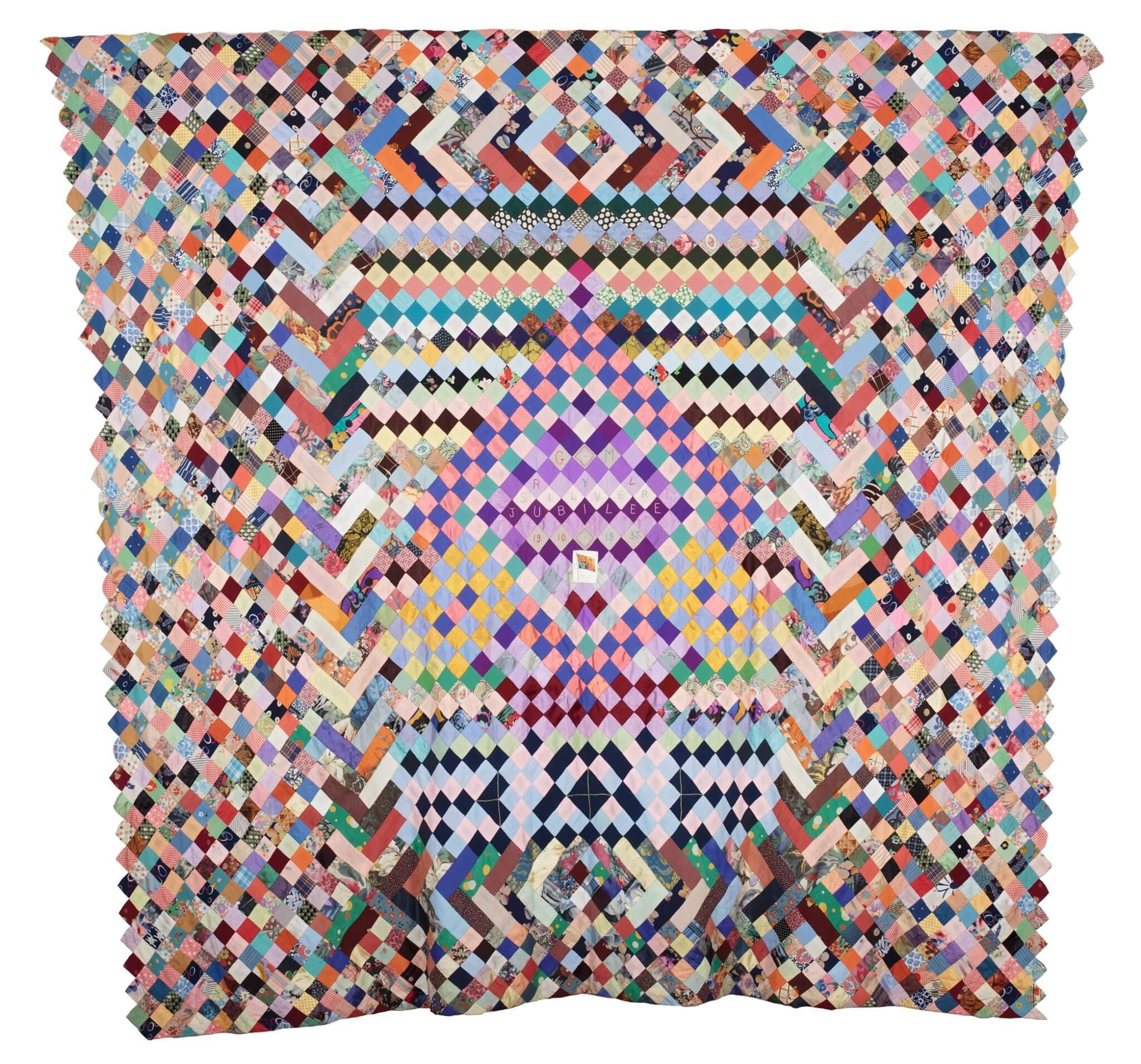 Quilt consisting of patchwork, all squares on point. The patches are a mixture of plain and printed dress cotton, silk and rayon fabrics.