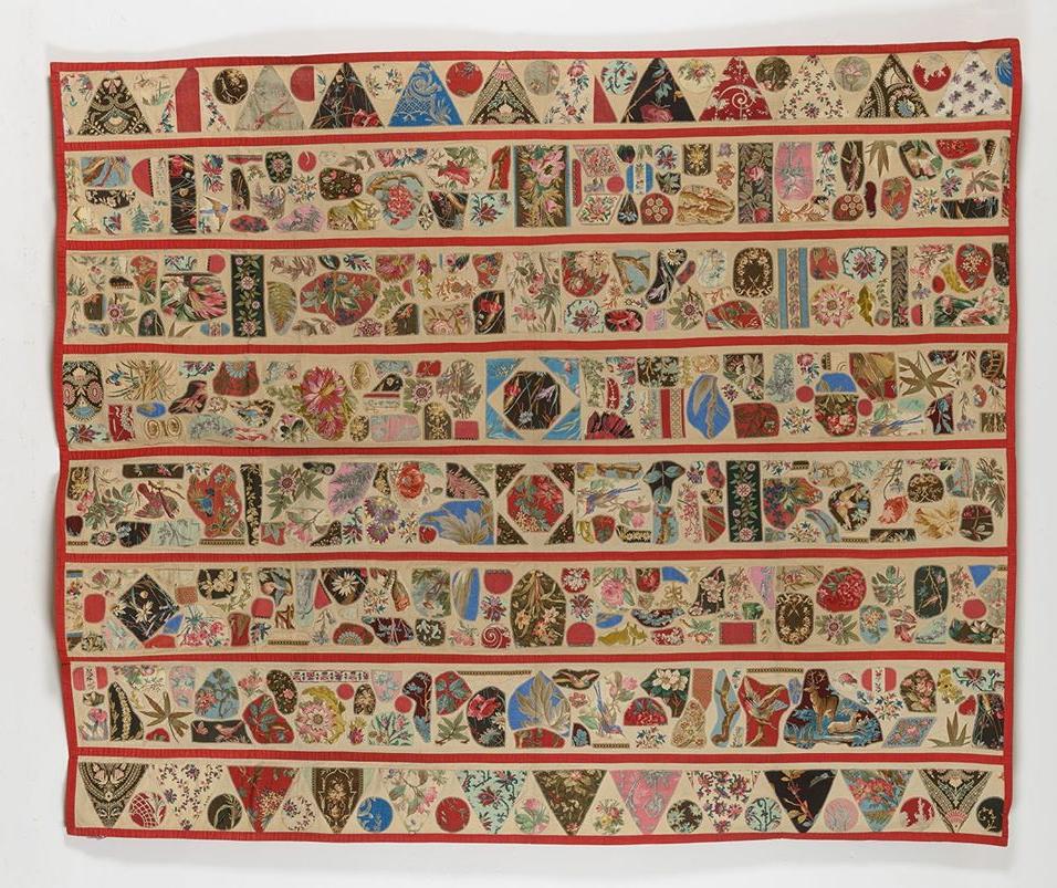 Applique quilt in gold and red