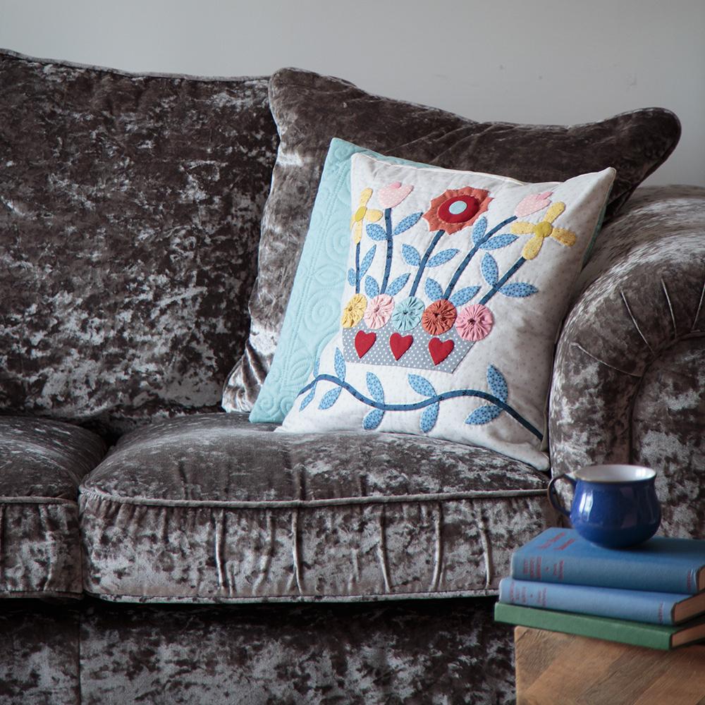 Appliqué cushion on a sofa