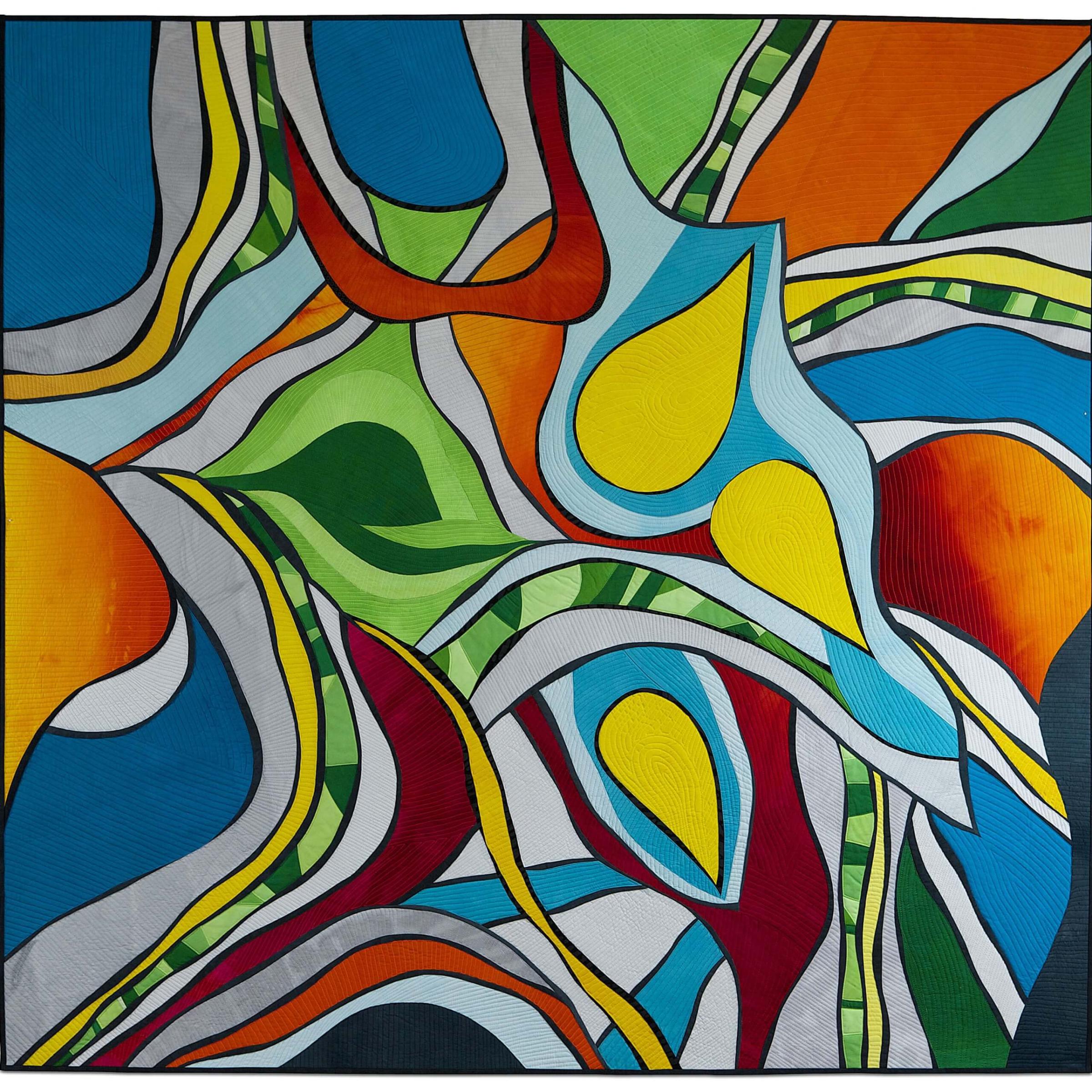 Quilt with multiple interlocking shapes in red, green, blue and yellow