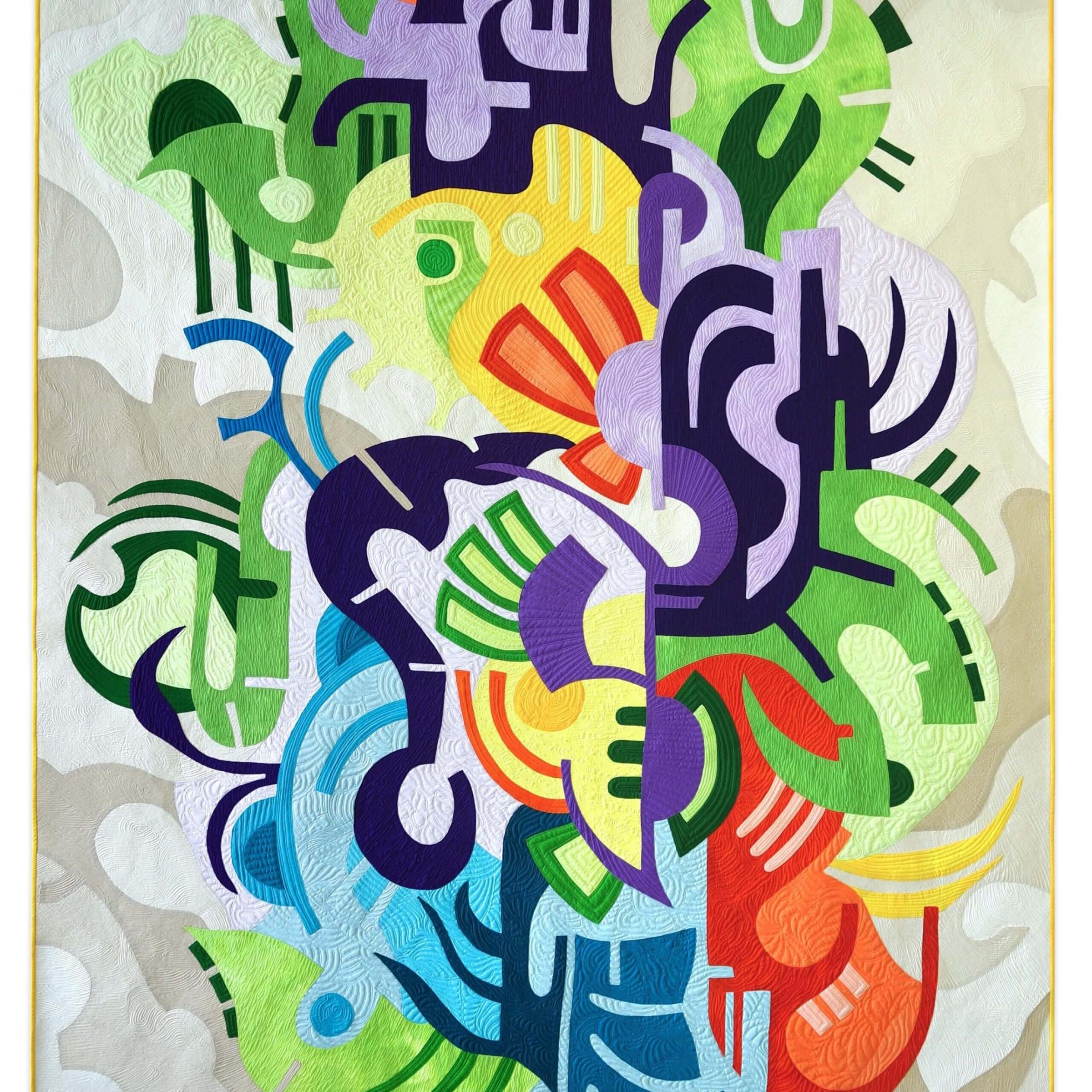 Quilt with multiple interlocking shapes in red, green, blue and yellow
