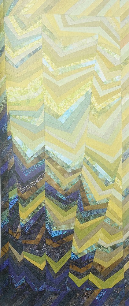 Quilt consisting commercial fabrics in columns of diminishing widths in blue and yellow