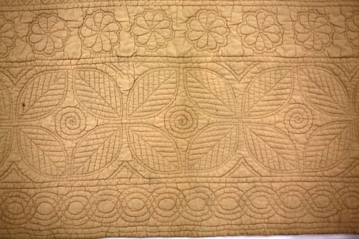 Claridges? Peach Wholecloth Quilt: Peach coloured quilt with foliage and floral pattern design