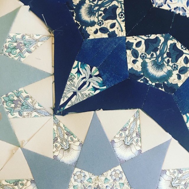 Close up of the join between 2 star shaped quilt pieces