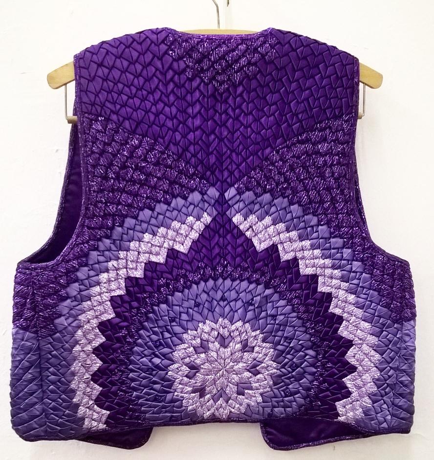 Purple quilted waistcoat with concentric circle pattern