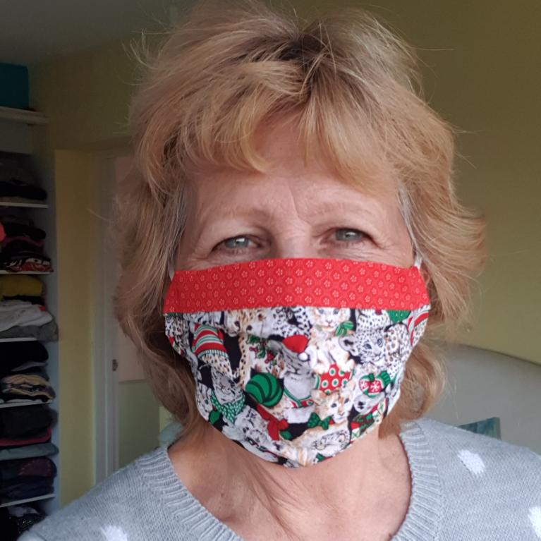 Moira Neal wearing a festive facemask