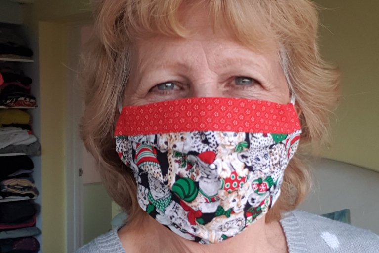 Moira Neal wearing a festive facemask