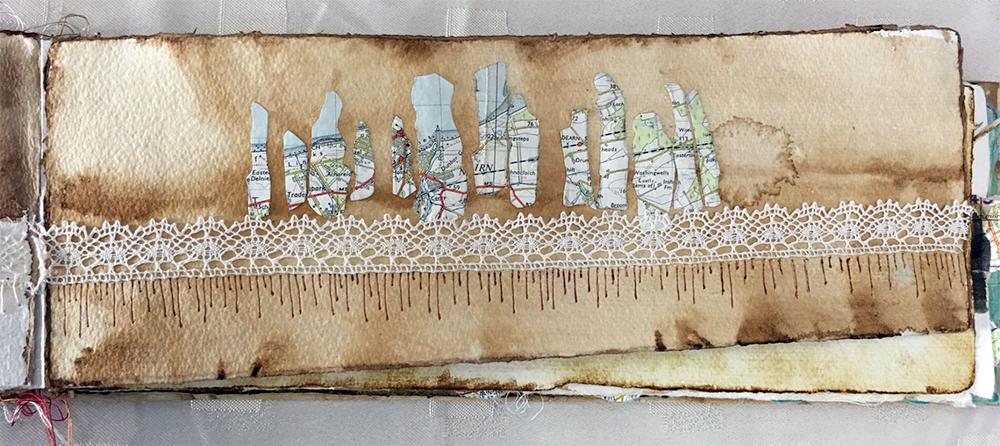 A sketchbook page by Lesley Bell: design work for her final C&G Diploma quilt. Painted with ink, using a collage of pieces of a map