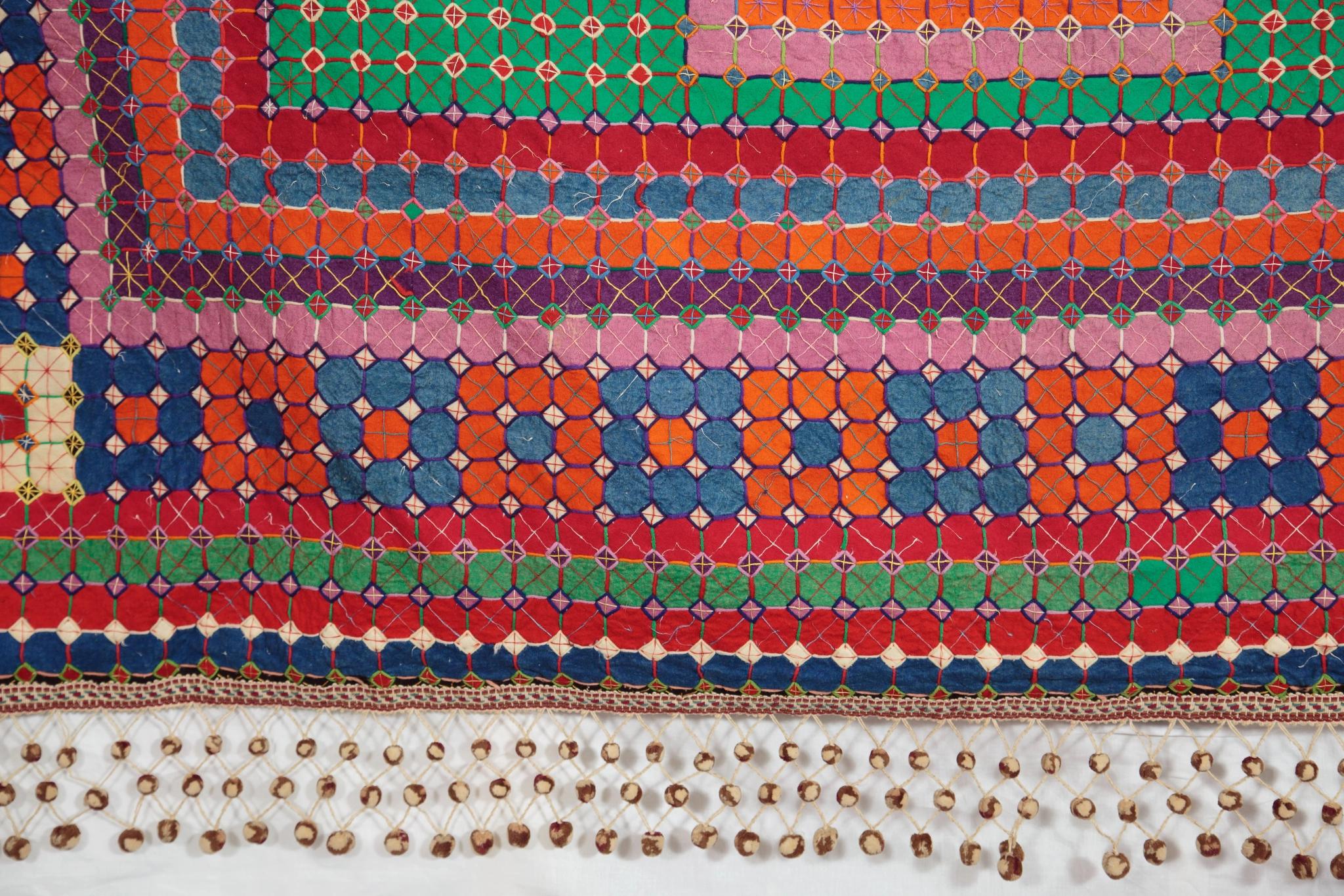 Close up showing tassles and border of Uncle Tom's Patchwork Coverlet, c1910-1920
