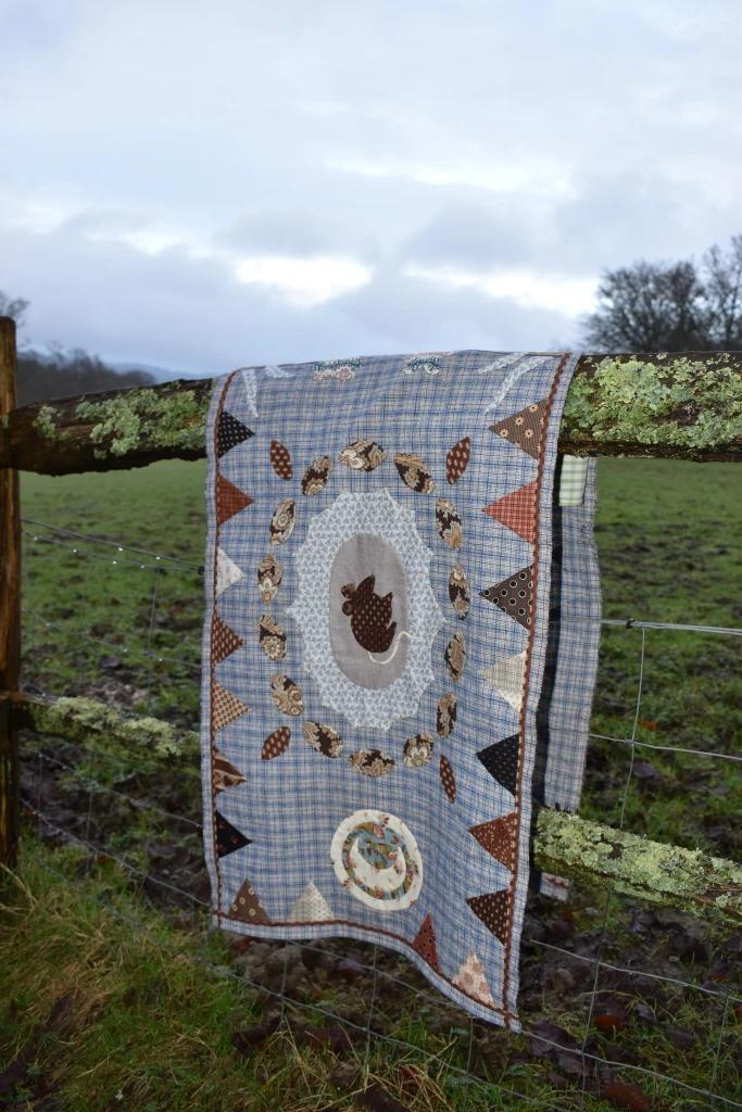 The Sequence of the Sun, the Moon and the Mouse hung over a fence
