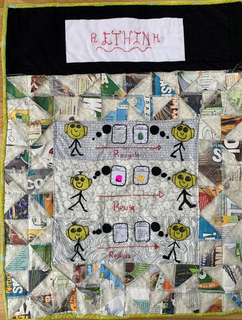 Quilt with a title 'Rethink' made of recycled fabrics and materials with images depicting the words Recycle, Reuse and Reduce