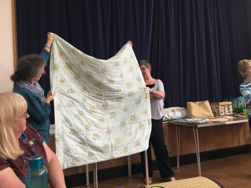 White quilt with tiny flower patterns