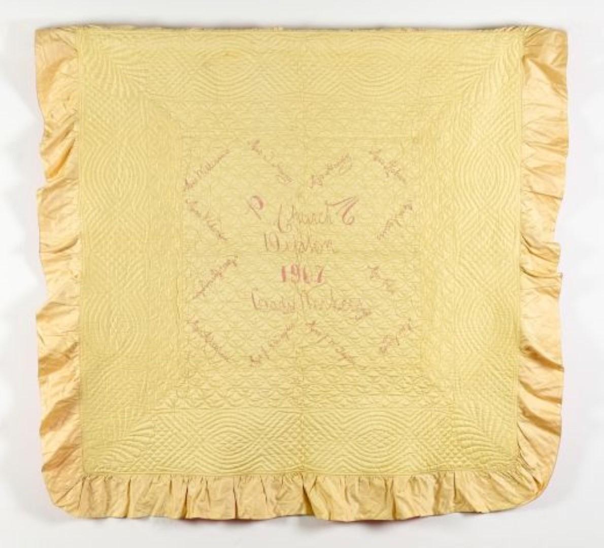 pale yellow quilt with frill