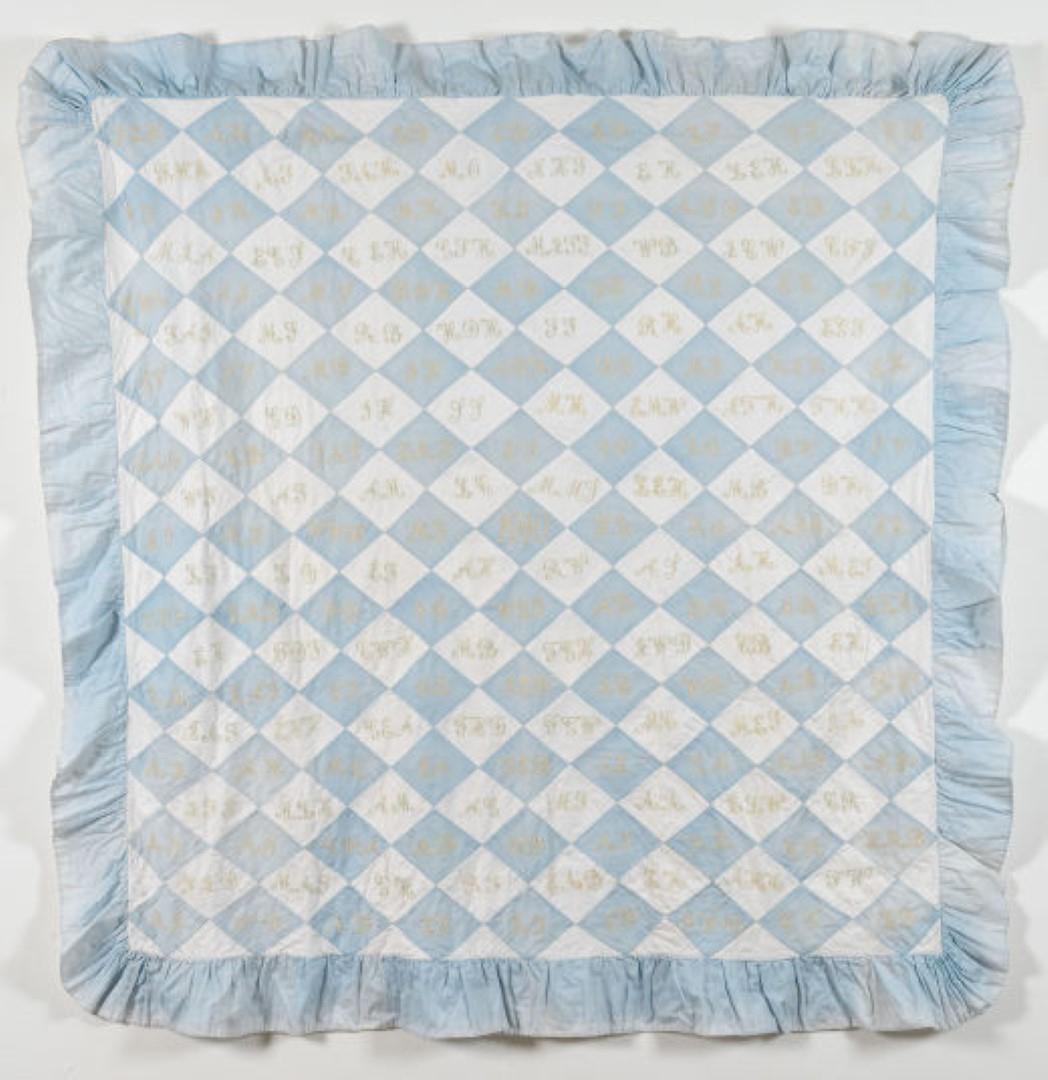Pale blue and white squares on point quilt