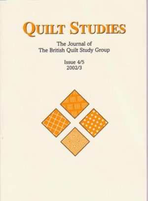 Booklet with four orange diamonds on cream background