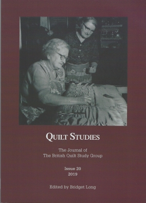 Booklet with elderly woman hand quilting watched by another woman