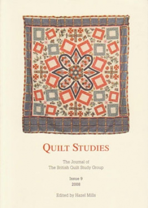 Booklet with patchwork quilt on white background