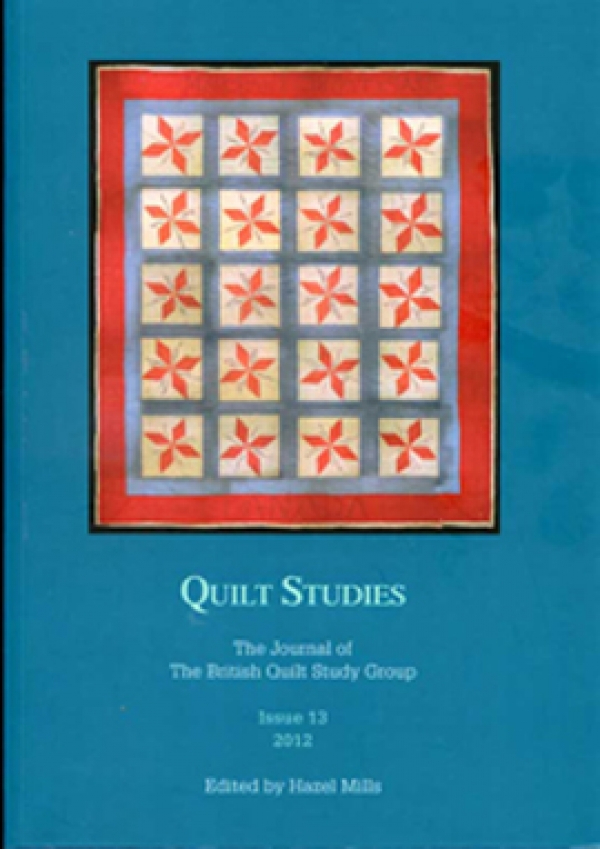 Booklet with red star quilt on blue background